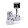 Silver pure steel dumbbell with textured ergonomic handle on a grey background.