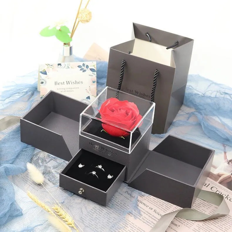Blue Valentine's Day jewellery gift box with a decorative white plastic rose inside.