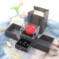 Blue Valentine's Day jewellery gift box with a decorative white plastic rose inside.