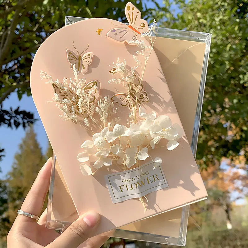 Handmade 3D butterfly greeting card showing stand-up design with artificial flowers on coated paper