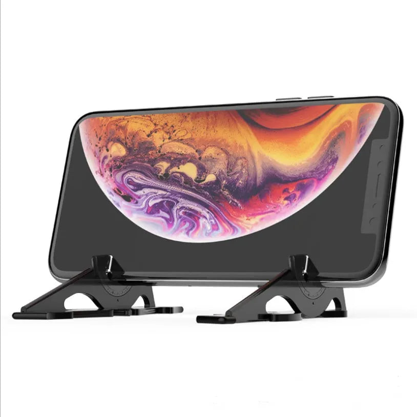 Black card type mobile phone holder on desk, holding smartphone at adjustable angle