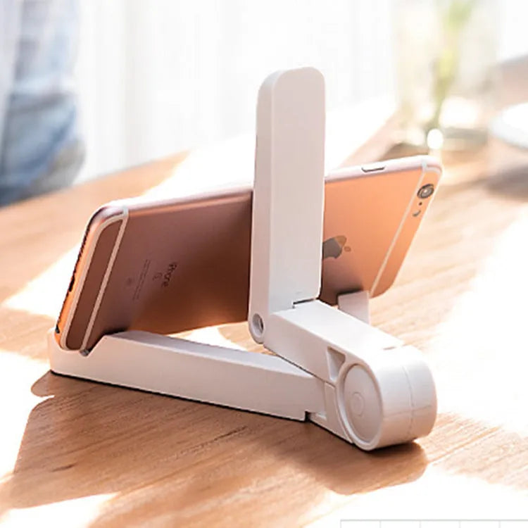 Foldable tablet holder in black showing multi-angle adjustment and non-slip rubber surface for device support