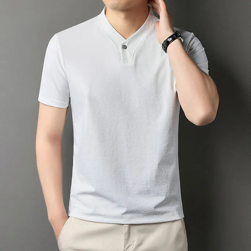 Young man wearing a short sleeve zip collar T-shirt in a casual setting.