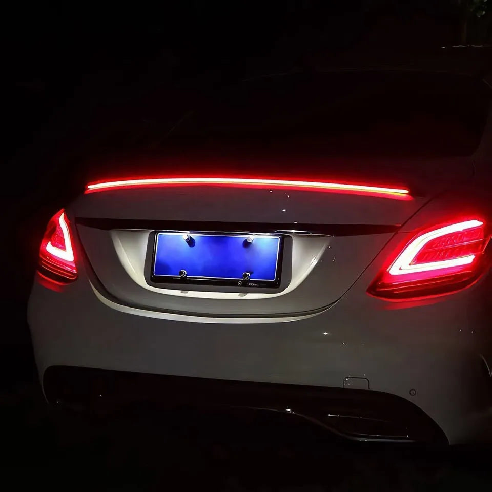 Automobile LED streamer tail wing turn signal light kit showing installation on car rear