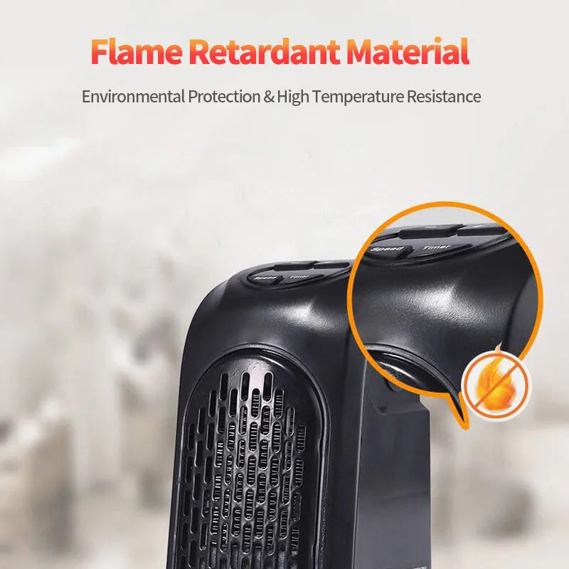 Small black ceramic fan heater with mechanical controls on a desk.