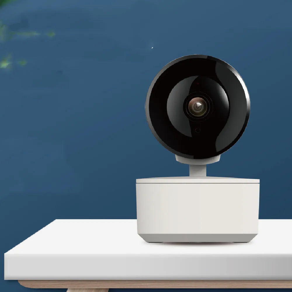Smart WiFi indoor security camera with 1080p clarity and 355-degree rotation on desktop