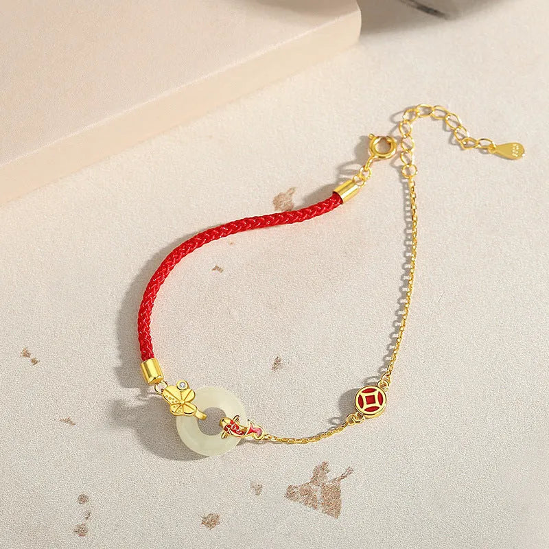 Gold electroplated 925 silver women's bracelet with koi and peace buckle design on adjustable red rope