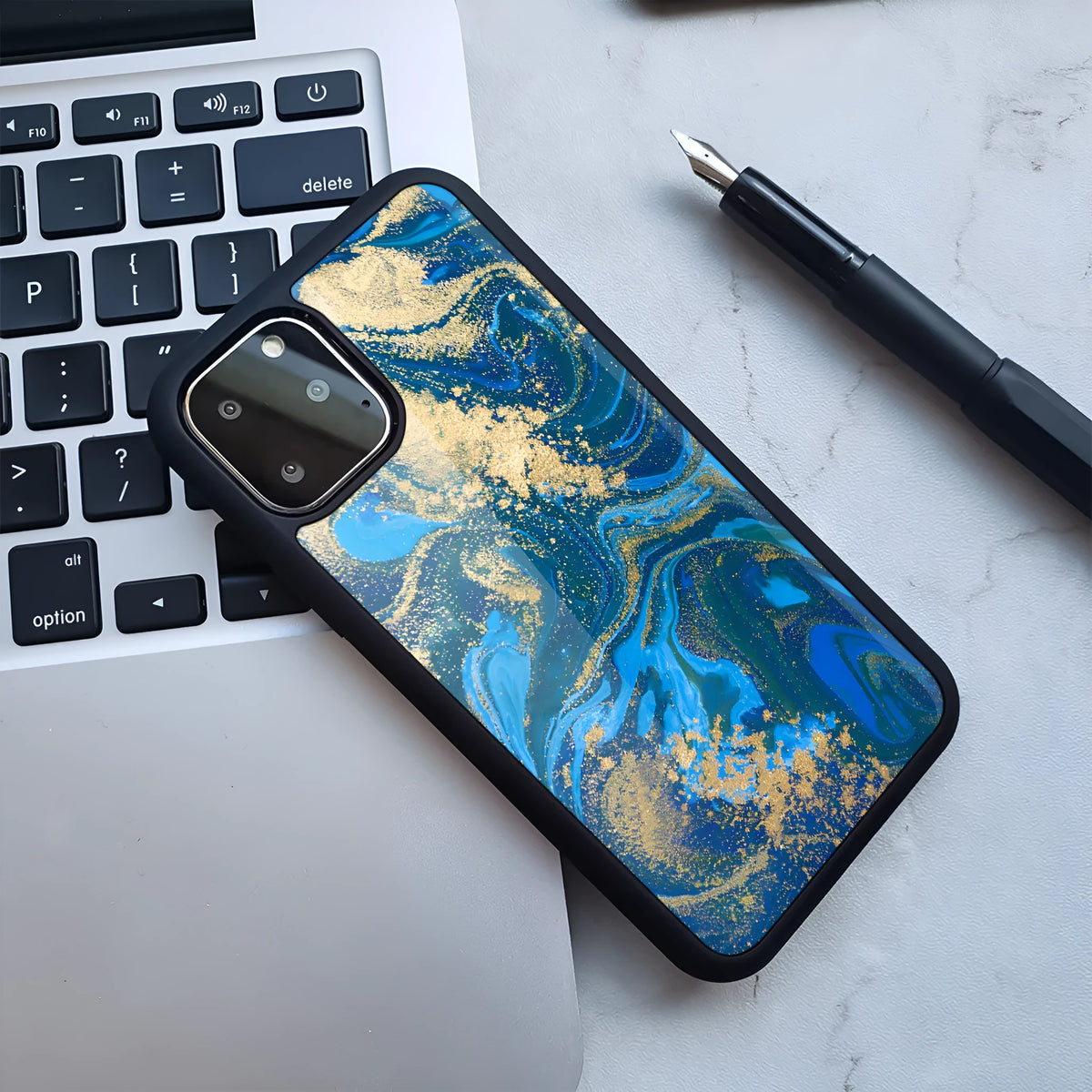 Marble pattern plastic back cover case for iPhone, shown in a blue and white colour variant.