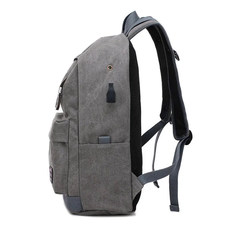 Canvas backpack with USB charging port showing front organisational pockets and adjustable shoulder straps