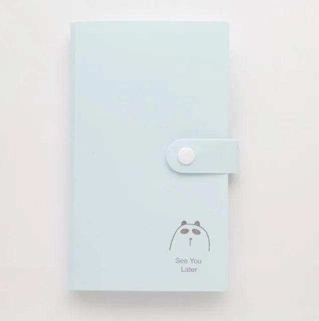 Blue PVC and PP business card holder book with protective shell showing insert pockets and smile logo.