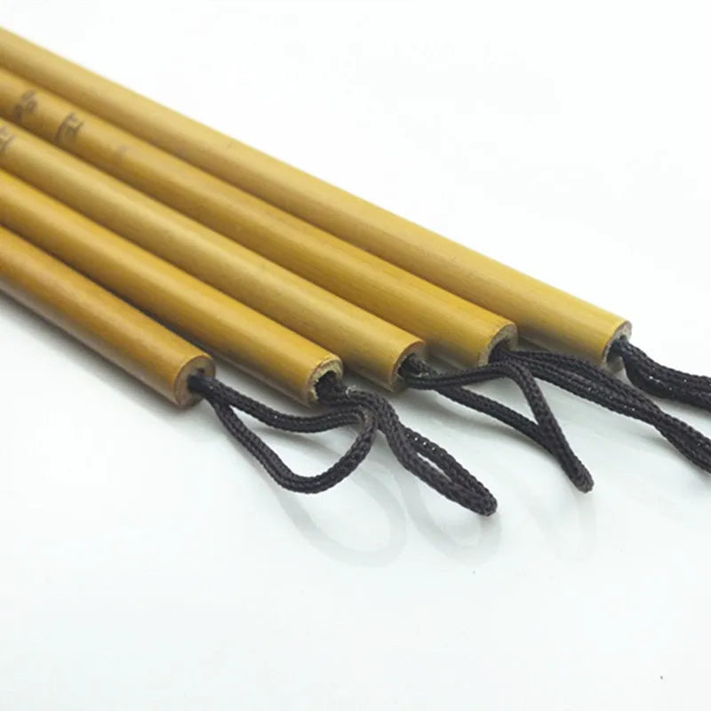 Small red-haired writing brush with a 23cm long handle on a flat surface.