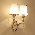 European wall lamp with glass shade in single and double head configurations for bedroom lighting