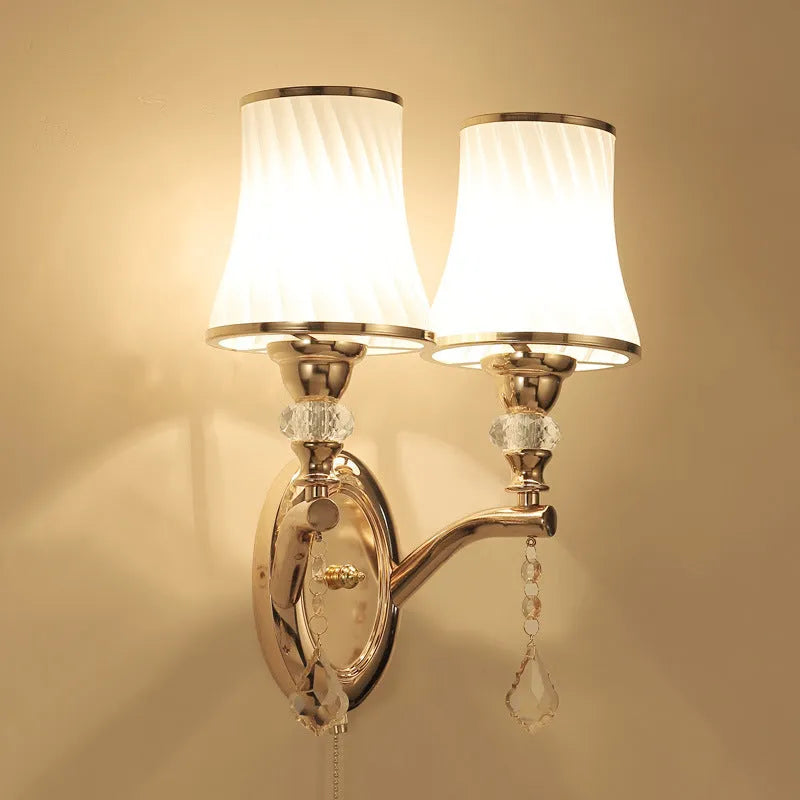 European wall lamp with glass shade in single and double head configurations for bedroom lighting