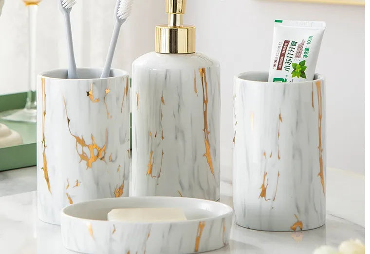 White ceramic bathroom wash kit set with two cups, a soap dish, and a latex bottle in a presentation box.