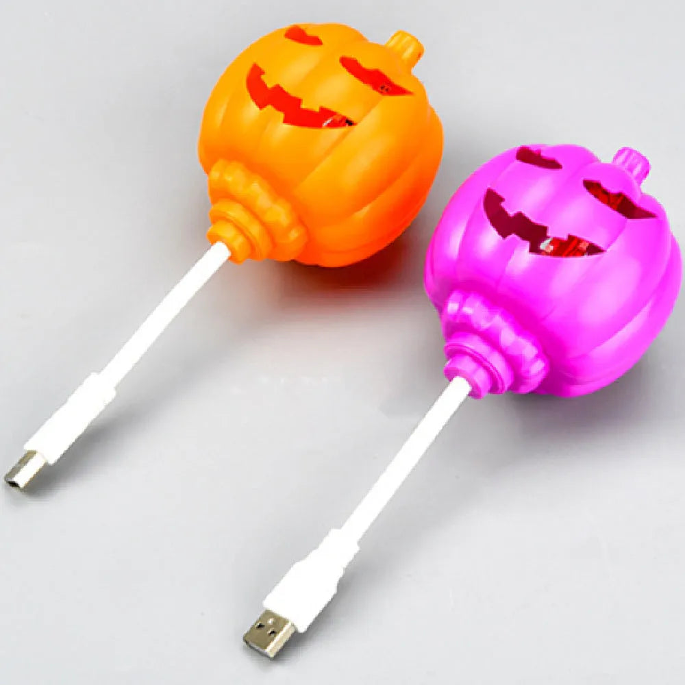 Pumpkin-shaped lamp with USB charging, 22cm tall, emitting yellow or purple light for holiday decor