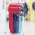 White portable electric lint remover device with USB charging port and removable lint collection compartment
