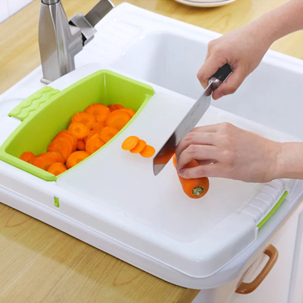 Green multi-function kitchen cutting board with integrated sink basket and drainage holes