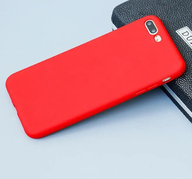 Frosted matte soft-shell iPhone case in multiple colours, shown fitting an iPhone.