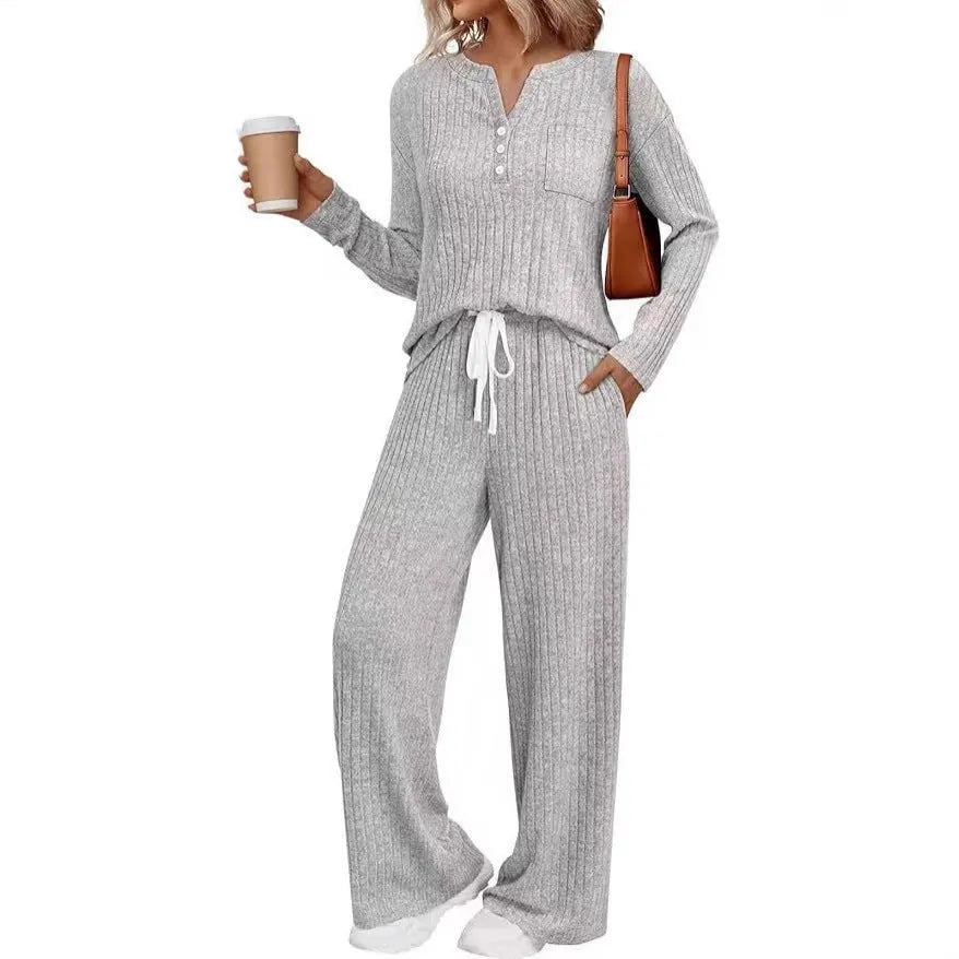 Women's knitted V-neck long coat with striped pattern and matching trousers in apricot colour