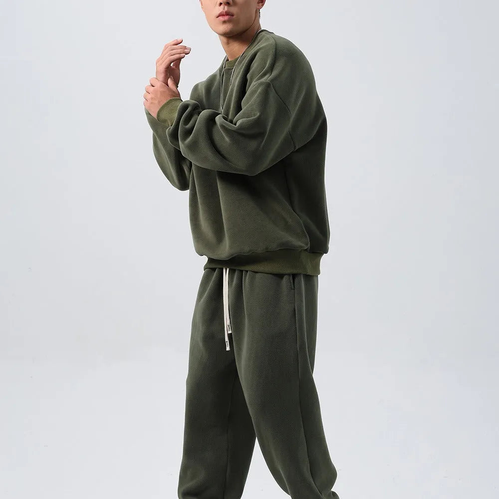 Men's black fleece sports suit with crew neck coat and loose fit trousers for winter wear