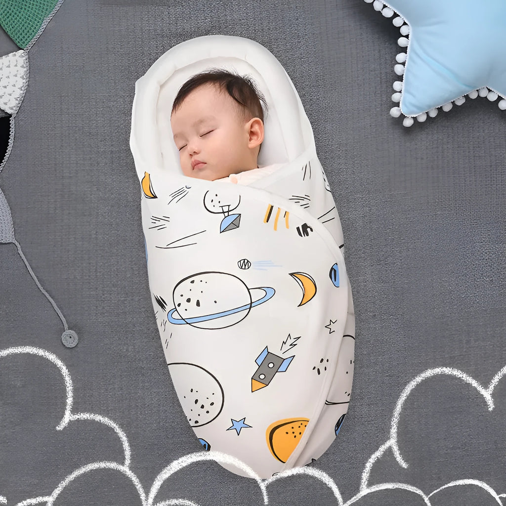 Cotton anti startle baby swaddle in a colourful pattern, laid flat showing its 30x60cm size.