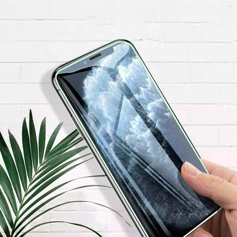Luminous tempered glass screen protector glowing on iPhone in dark room with 9-layer protection diagram