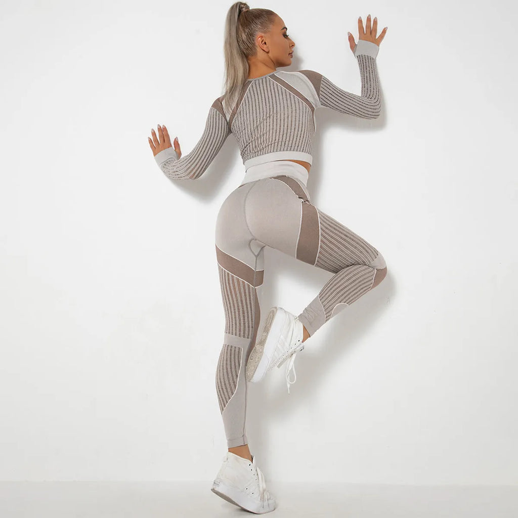 Women's long-sleeved seamless yoga suit in a striped pattern, shown in a stretch fabric suitable for exercise.