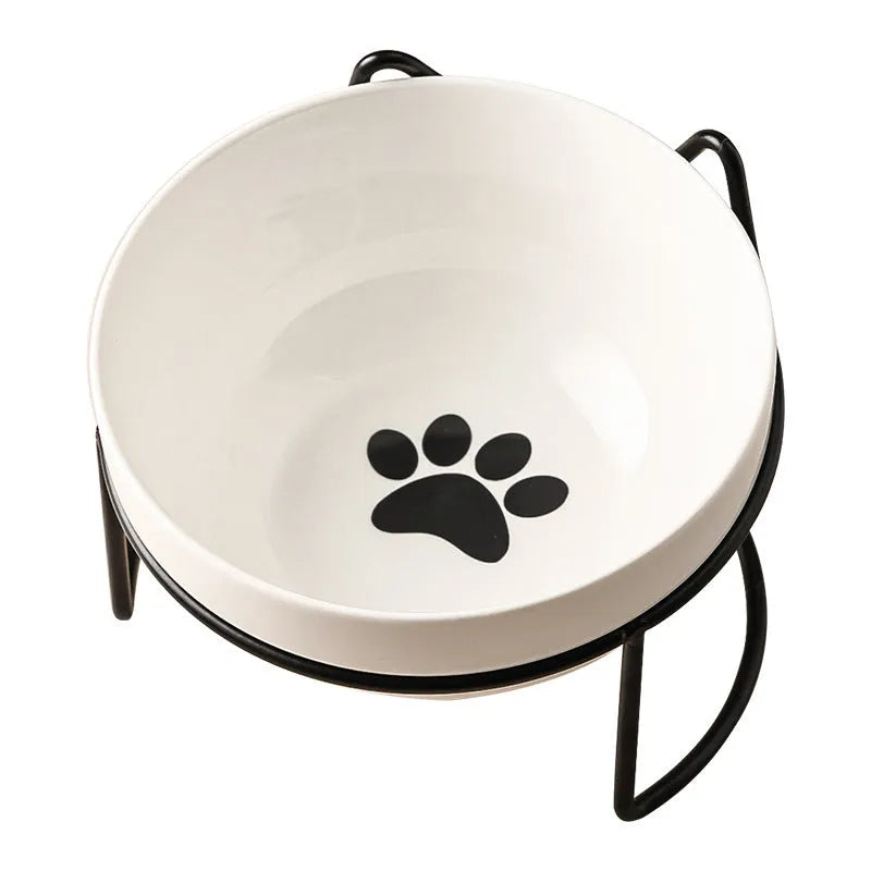 White ceramic cat bowl with cat footprints pattern on black iron frame