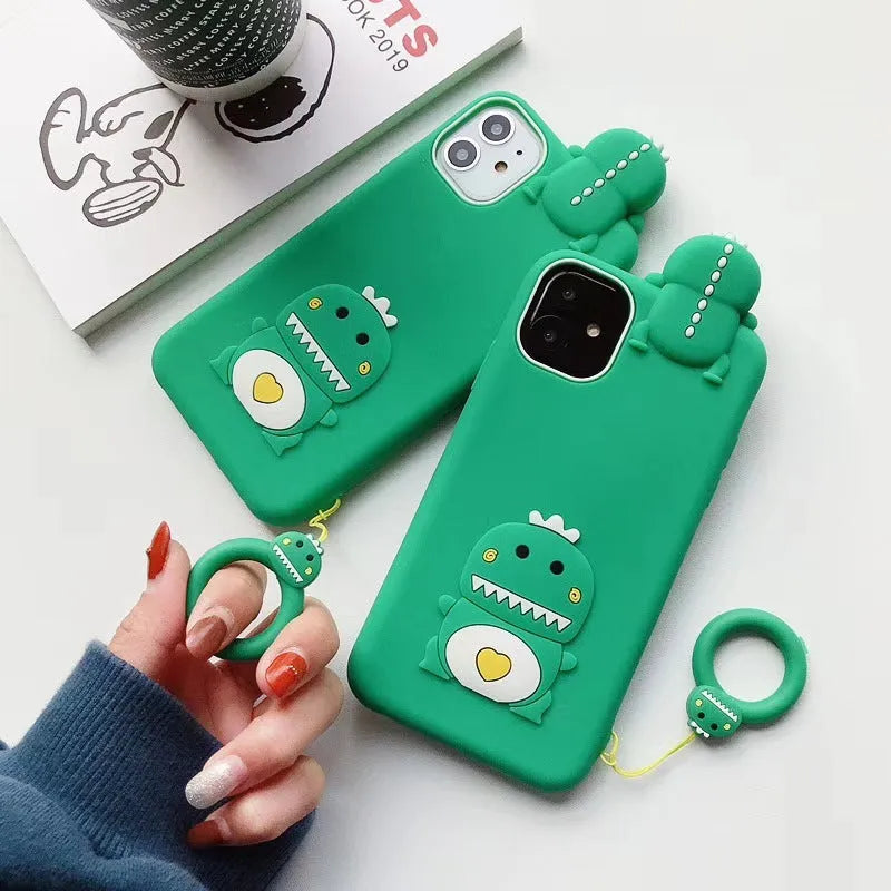 Green silicone iPhone case with cartoon animal design showing raised edges and precise port cutouts for charging and audio