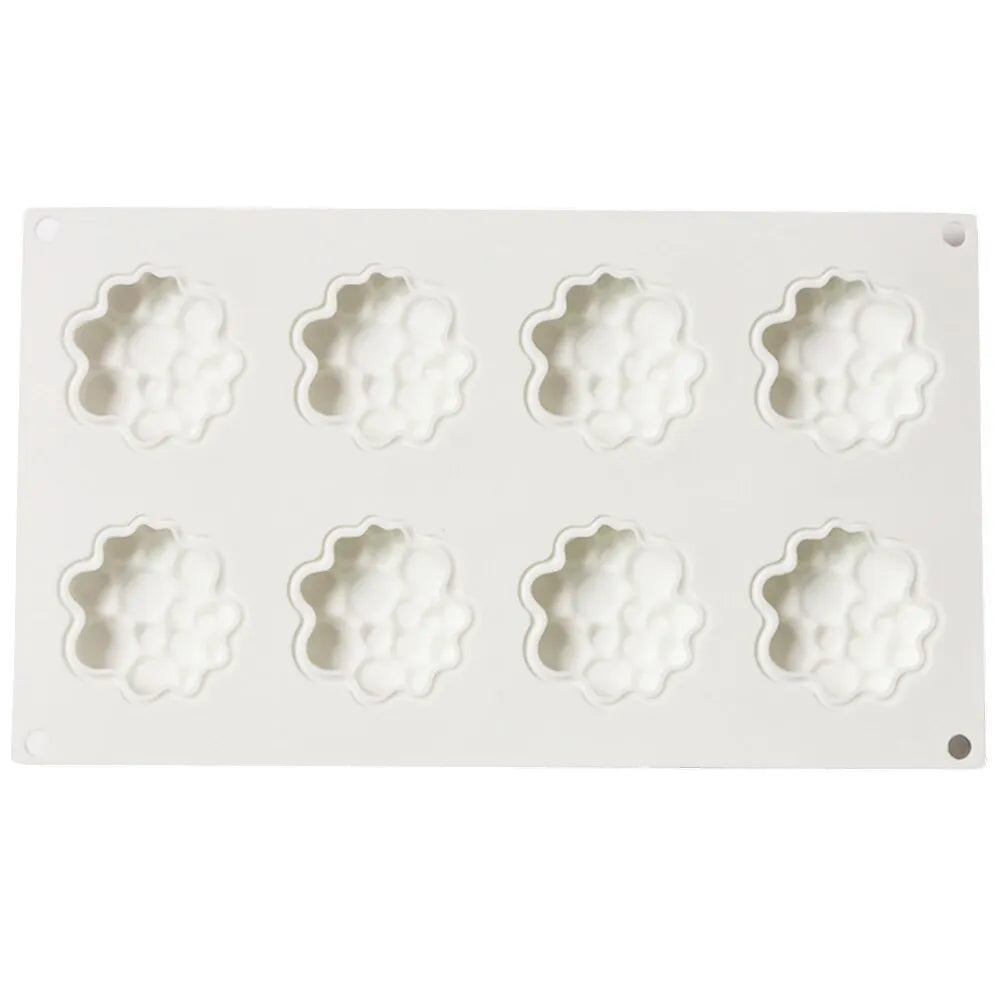 Round silicone cake mould with 8 bubble tower pattern design on a kitchen worktop.