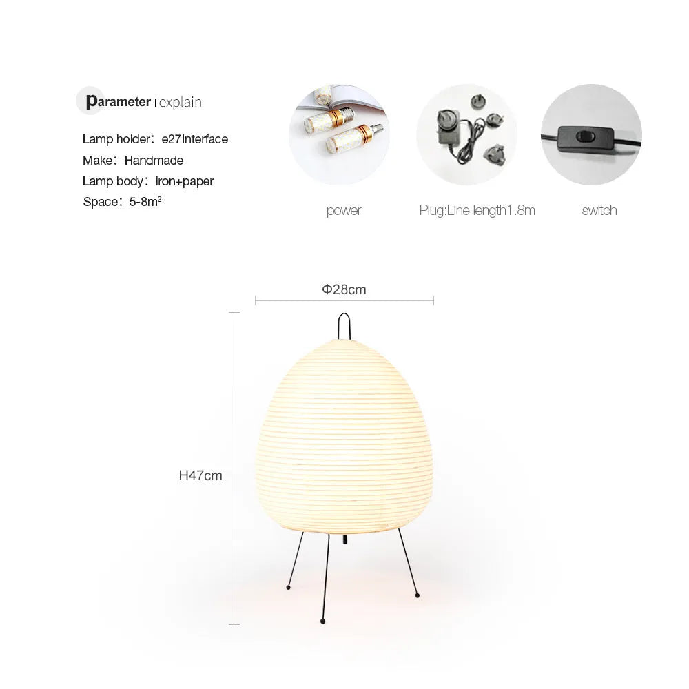 Japanese style rice paper table lamp with aluminium base on a wooden surface.
