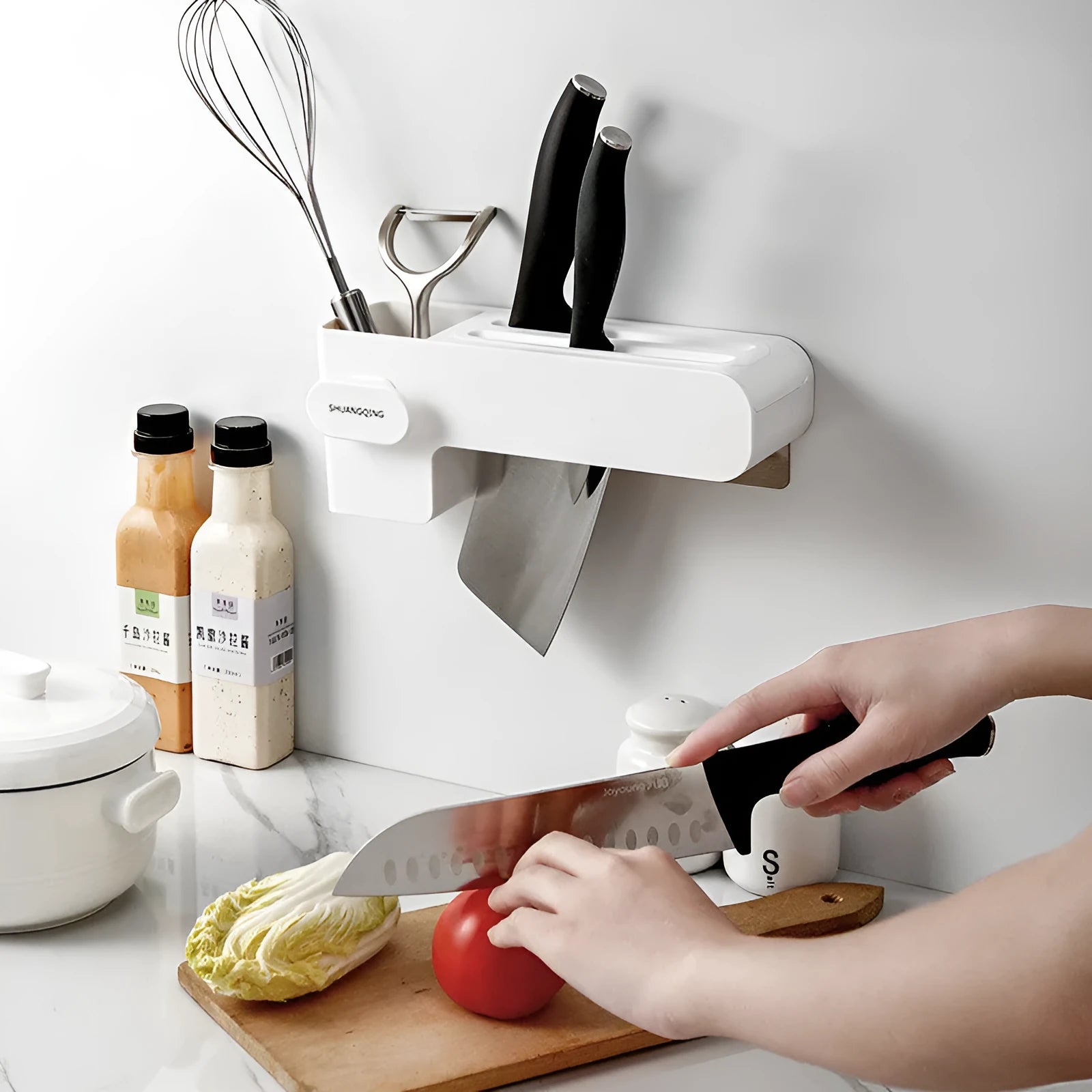 Modern white plastic kitchen knife rack with non-slip strip for wall or drawer mounting.