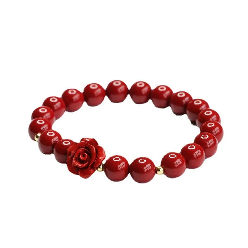 Purple gold sandstone cinnabar bracelet with 8mm rose-carved beads on wrist