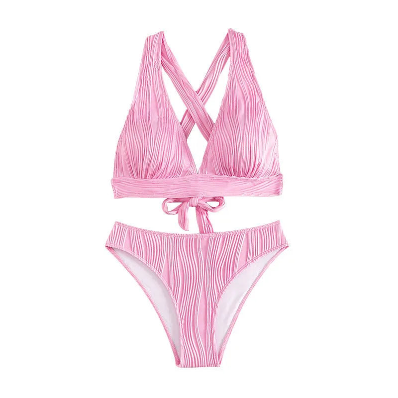 Women's pink halter strap bikini swimsuit with matching shorts on a mannequin
