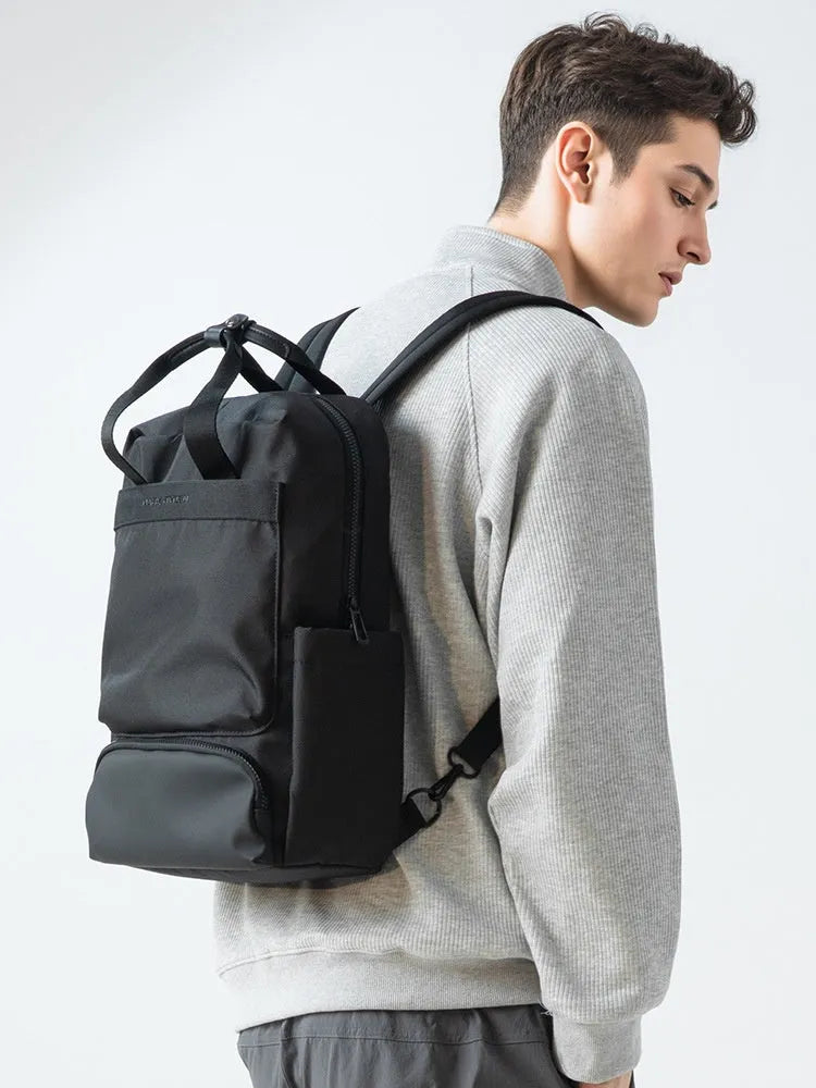 Elegant black Oxford cloth computer backpack showing 20-35 litre capacity