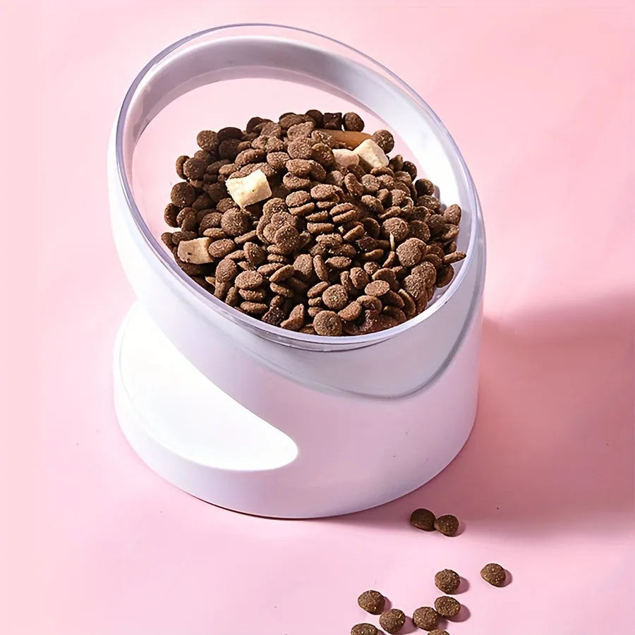 Clear elevated cat food bowl with 15-degree tilt angle on white surface