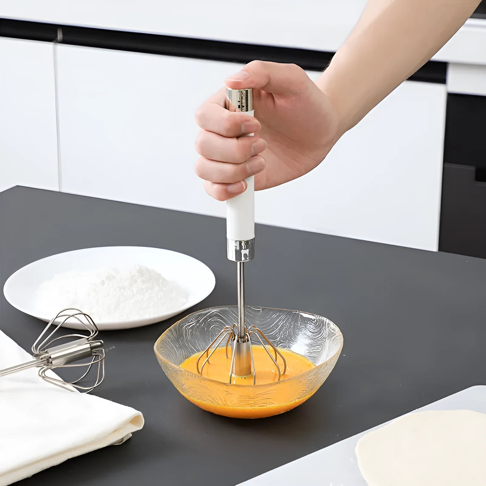 Semi-automatic stainless steel egg beater whisk with hand pressure rotating mechanism in silvery or white colour