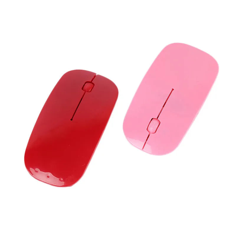 Wireless USB computer mouse shown in multiple colour options: black, blue, green, pink, red, and white.