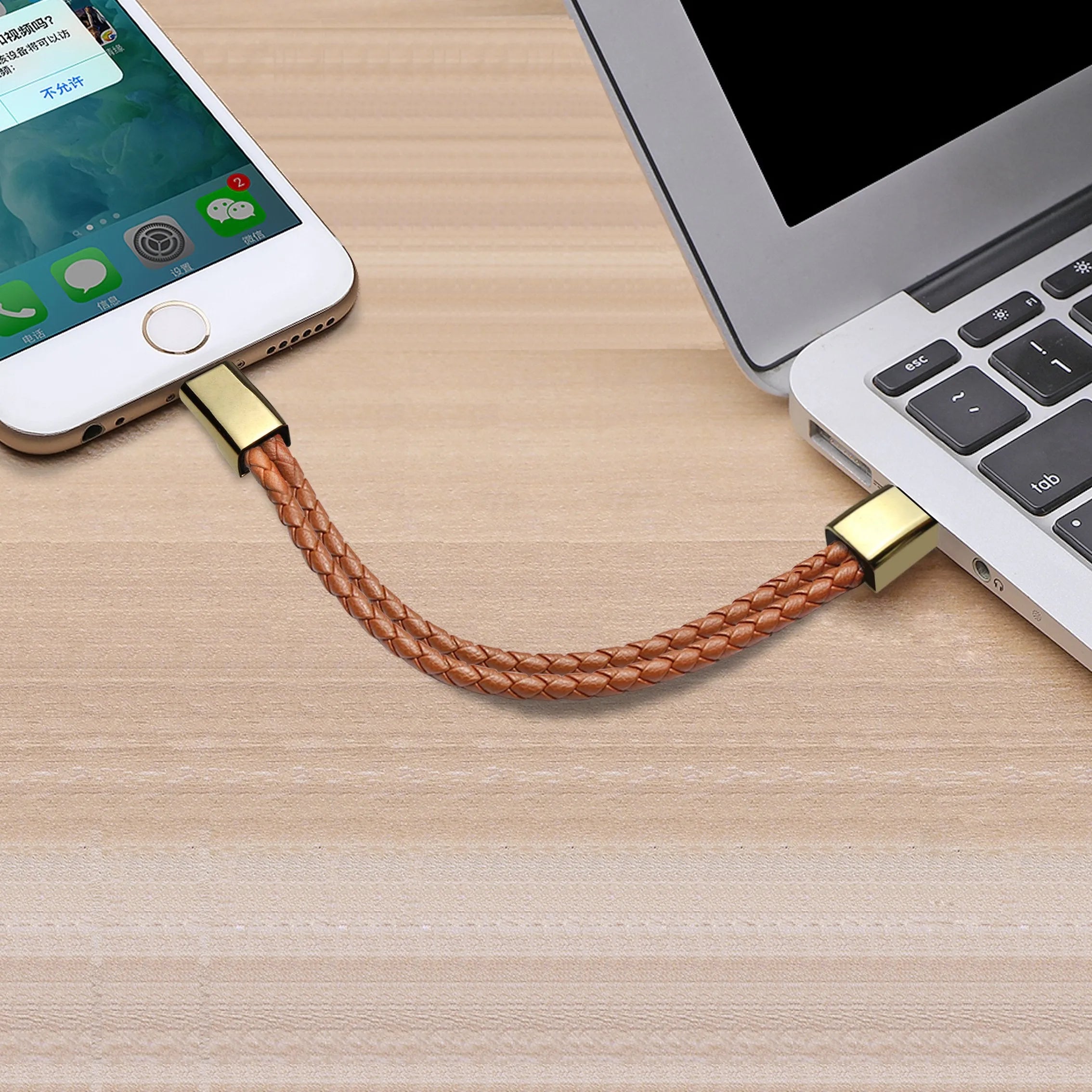 Brown braided double-line USB charging cable in a presentation gift box.
