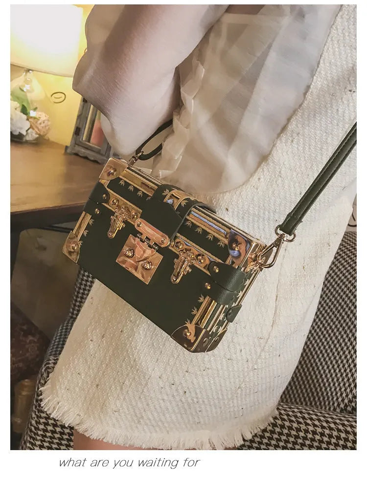 Women's hard PU shoulder bag with flap closure and single strap in black or green, showing rivet decoration