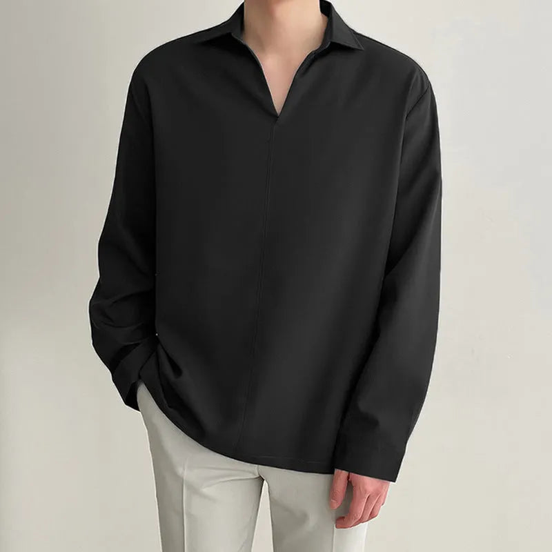 Men's loose fit long sleeve casual business shirt in a solid colour on a hanger