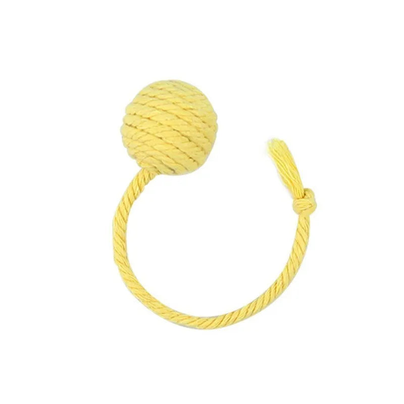 Colourful cat toy ball with attached rope and internal bell mechanism in green, pink, purple, or yellow options