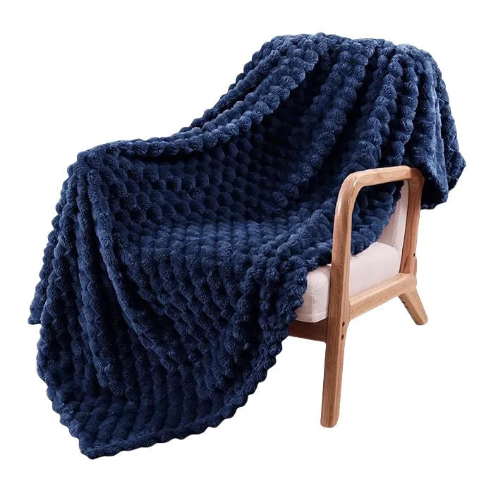 Children's plaid velvet blanket in camel colour, showing soft texture and size scale for cosy use.