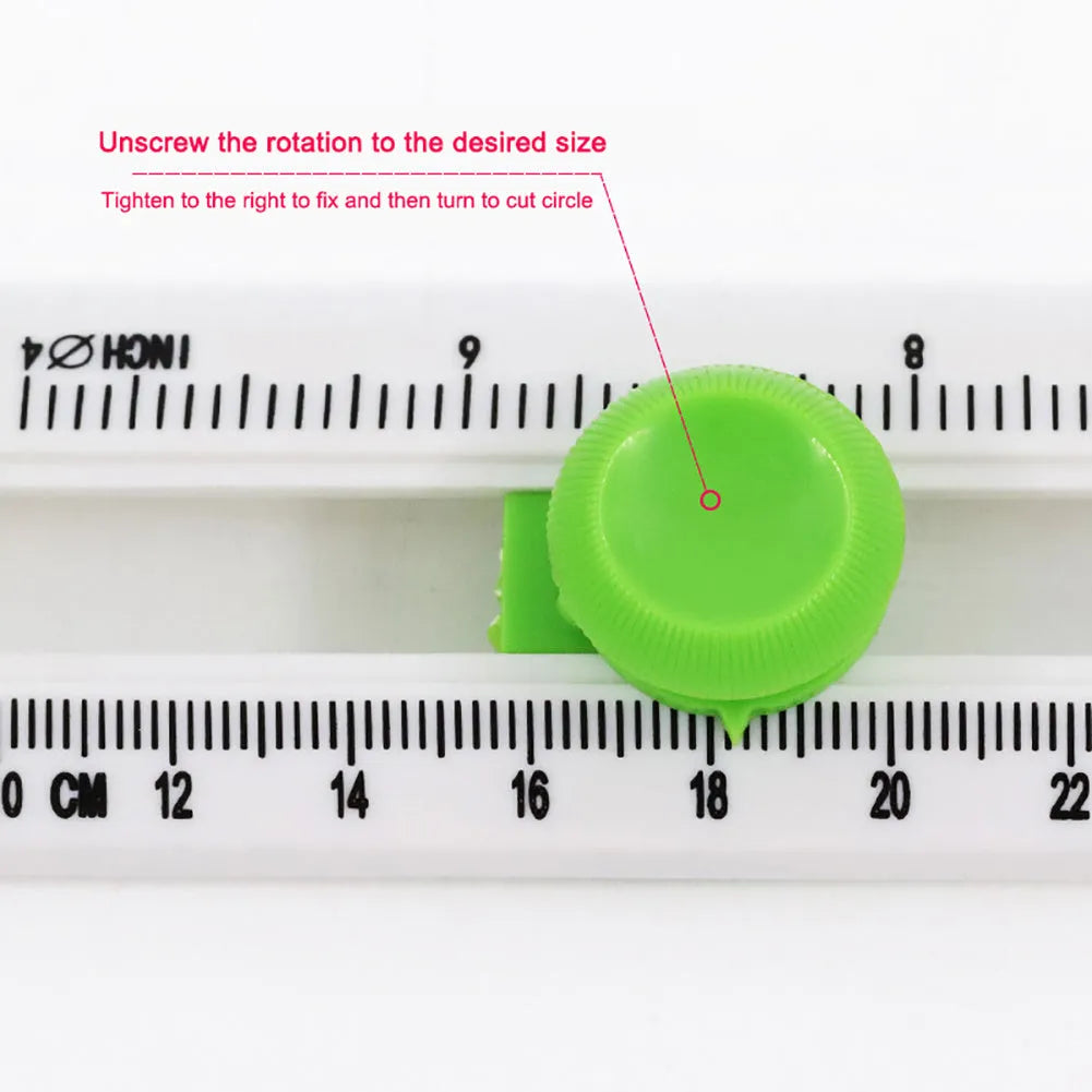 Orange or green plastic round paper cutter on a colour box, capable of cutting A3 paper.