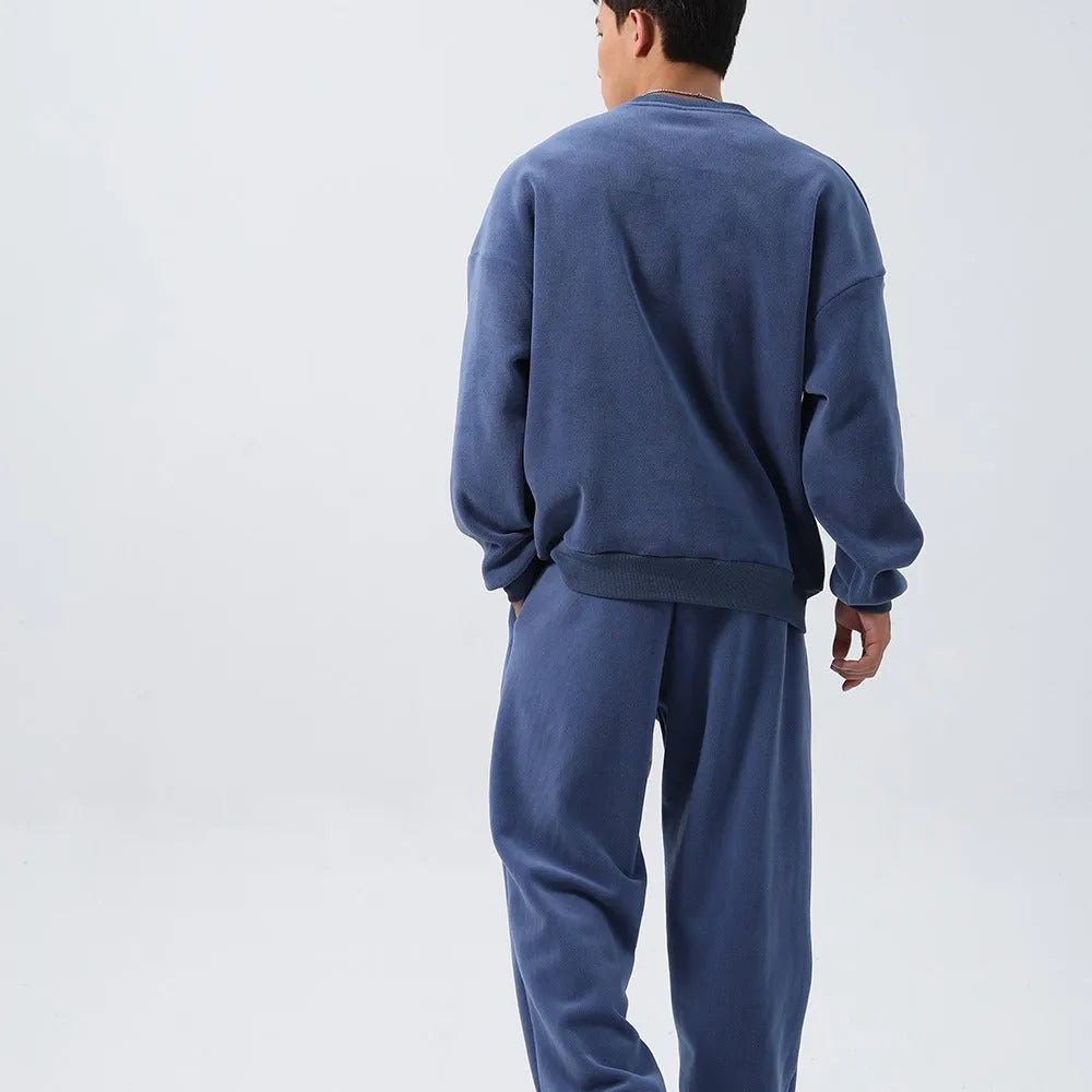 Men's black fleece sports suit with crew neck coat and loose fit trousers for winter wear