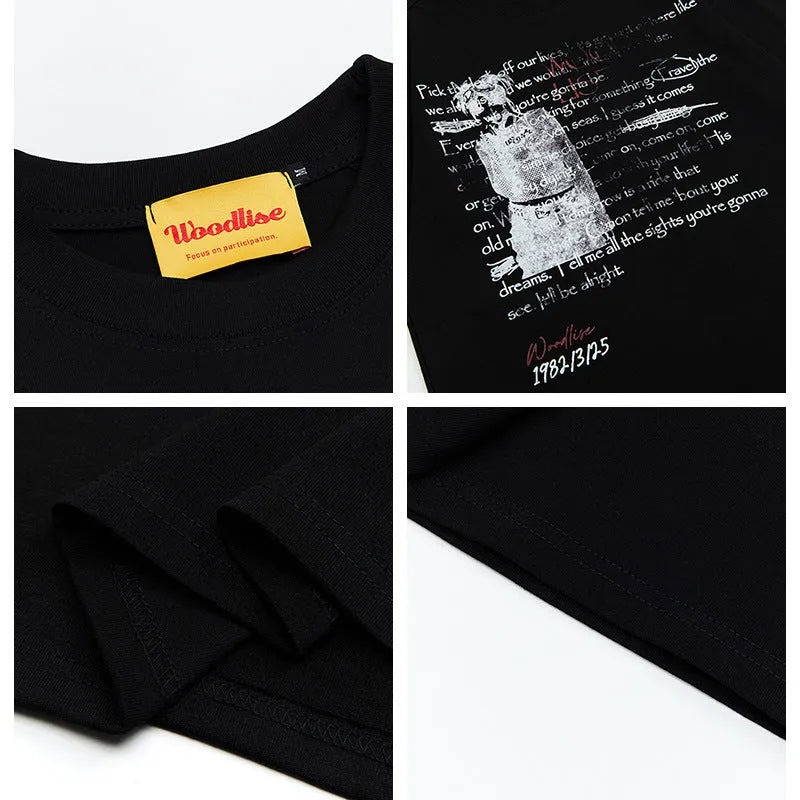 Men's black loose fit cotton t-shirt with white letter print and raglan sleeves on hanger