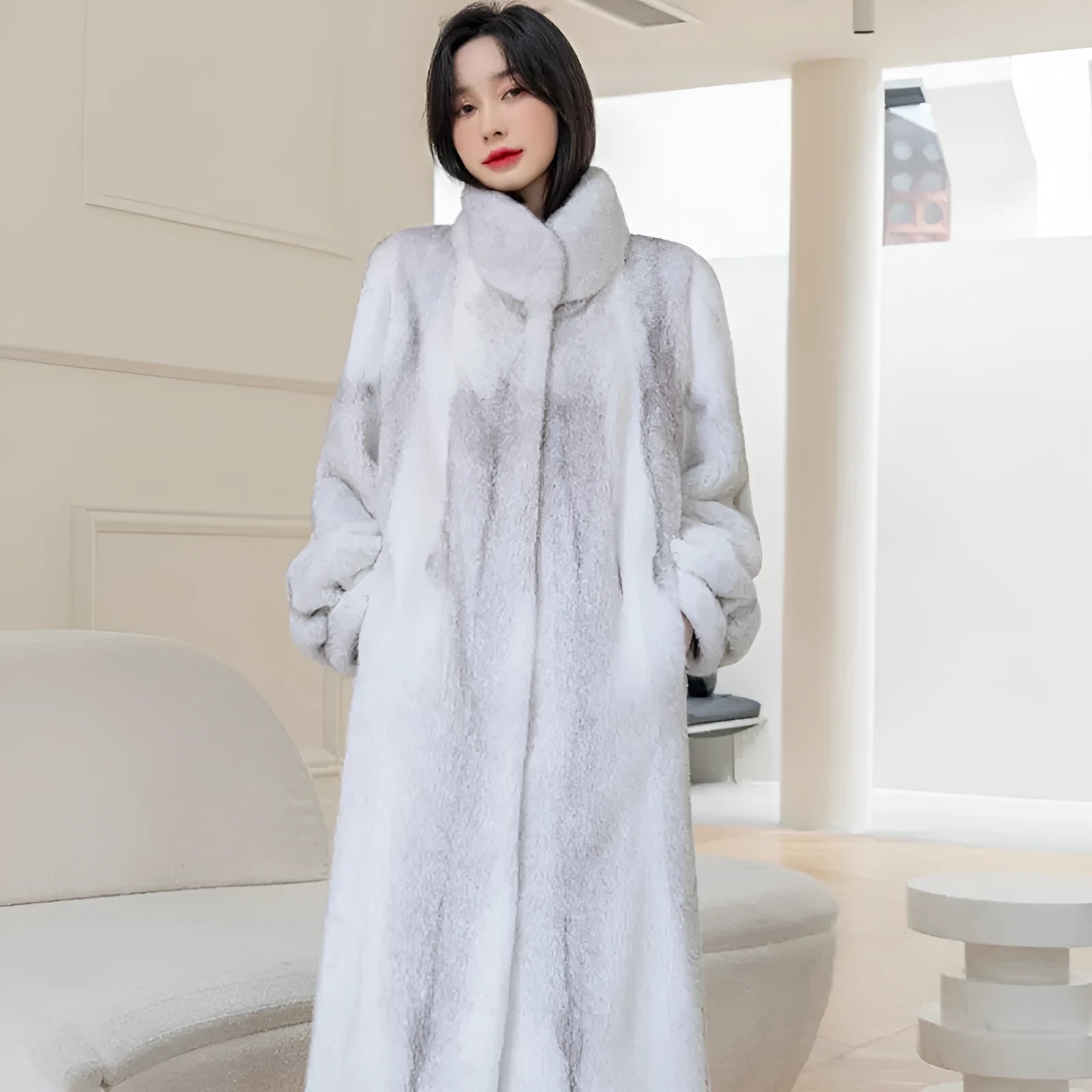 White women's faux fur coat with a stand-up collar, shown full-length.