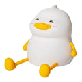 Chubby Night Light TW-L73 on desk showing silicone phone holder with mobile device and adjustable brightness settings
