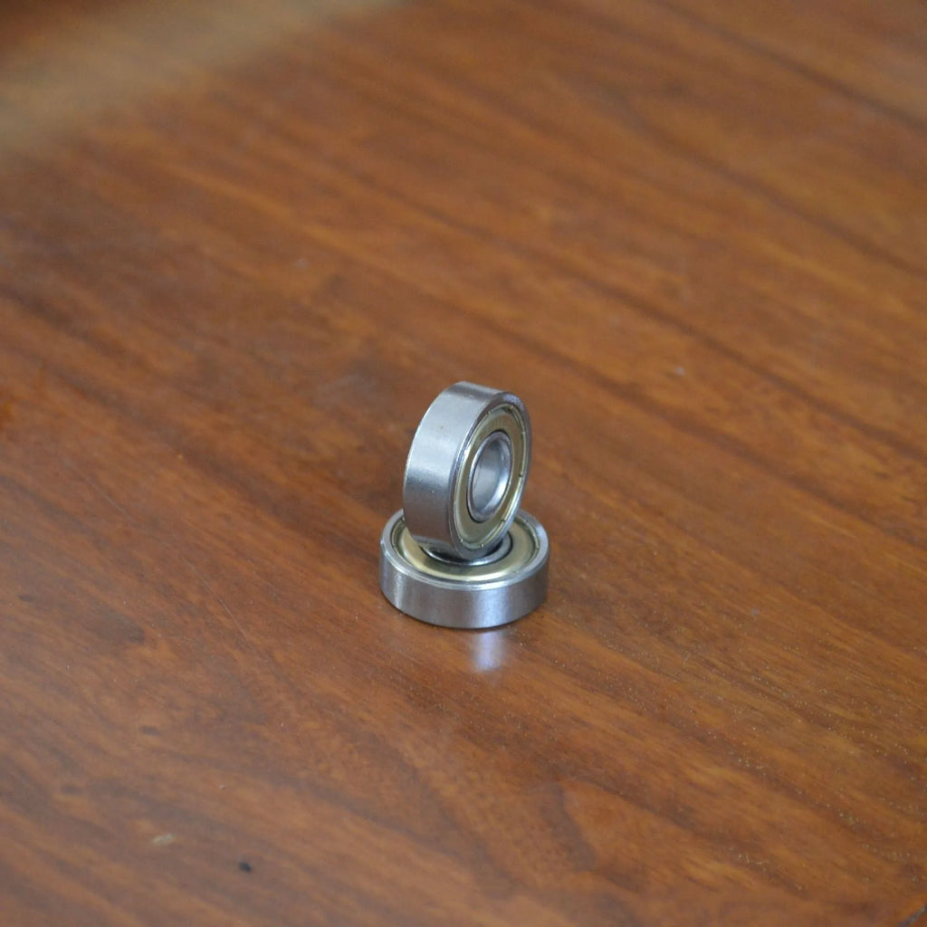 6000zz carbon steel radial ball bearing with 10mm bore, 26mm outer diameter, and steel retainer.
