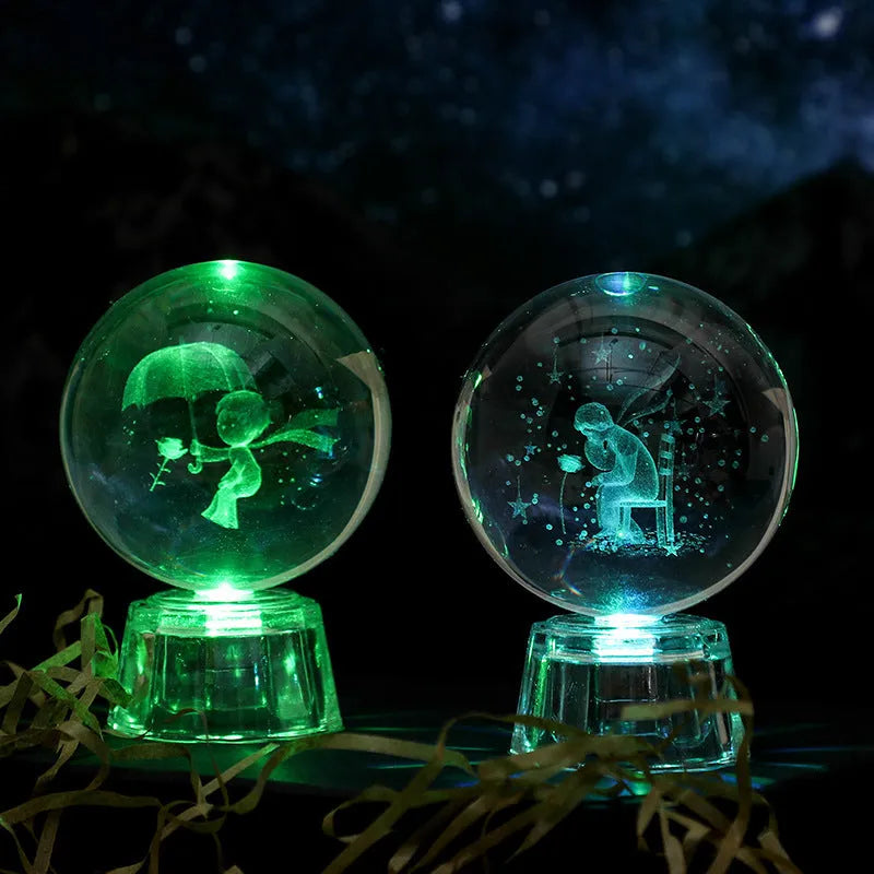 Transparent 6cm white crystal ball ornament with inner carving patterns illuminated by small night lamp on tabletop